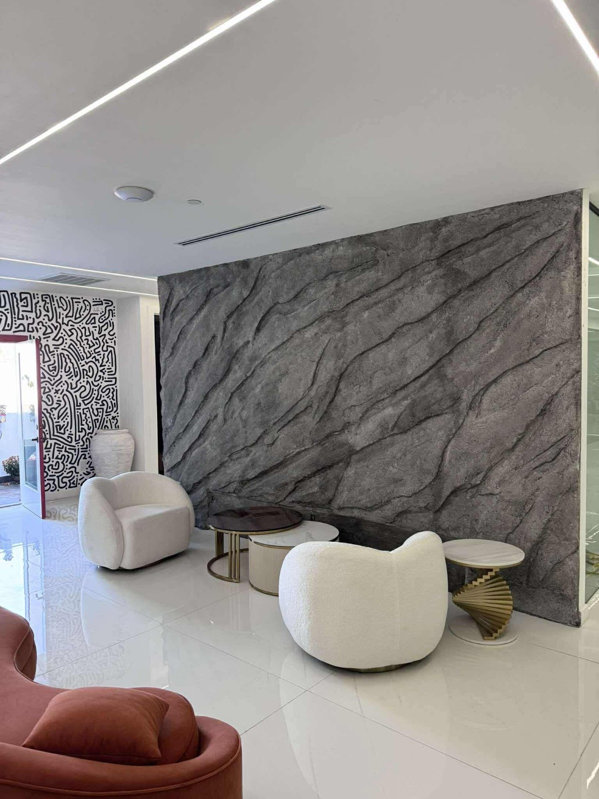 Volcanic stone wall installation in modern office lobby