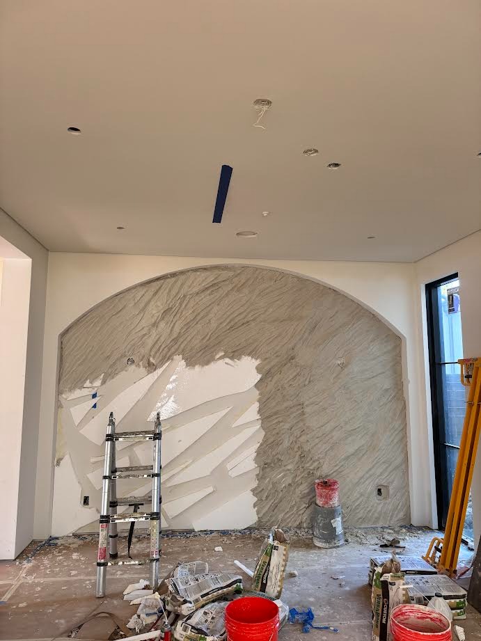 Arched wind-shaped wall under construction